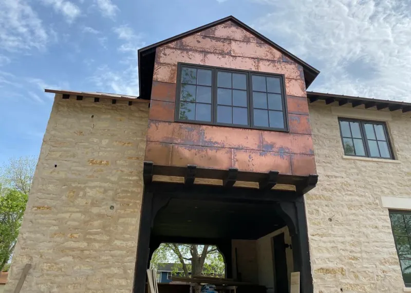Copper metal panel facade on a stone building for Metal Roof Coating in Oak Park